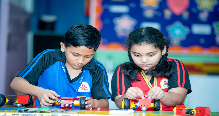 students learning robotics in any cbse board ideal school in India