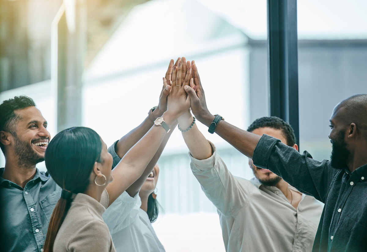 Mental health technologies: team putting their hands together