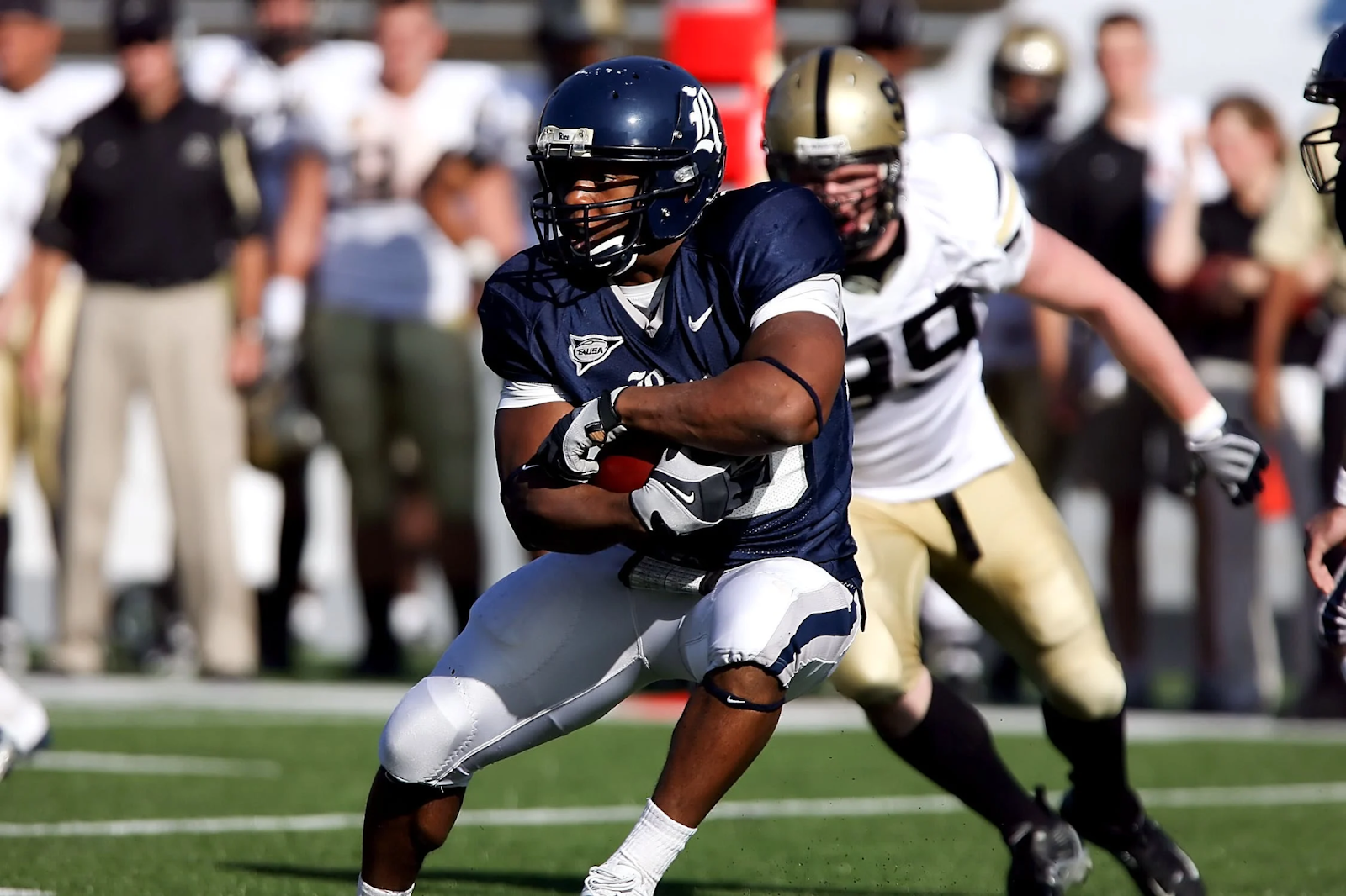 professional football players fighting for possession 