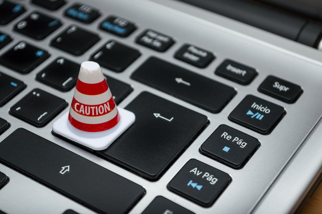 Free White Caution Cone on Keyboard Stock Photo