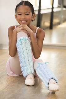 little girl dressed in ballet clothes with crochet legwarmers