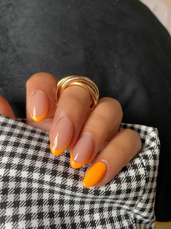 Bright orange nails with french tips