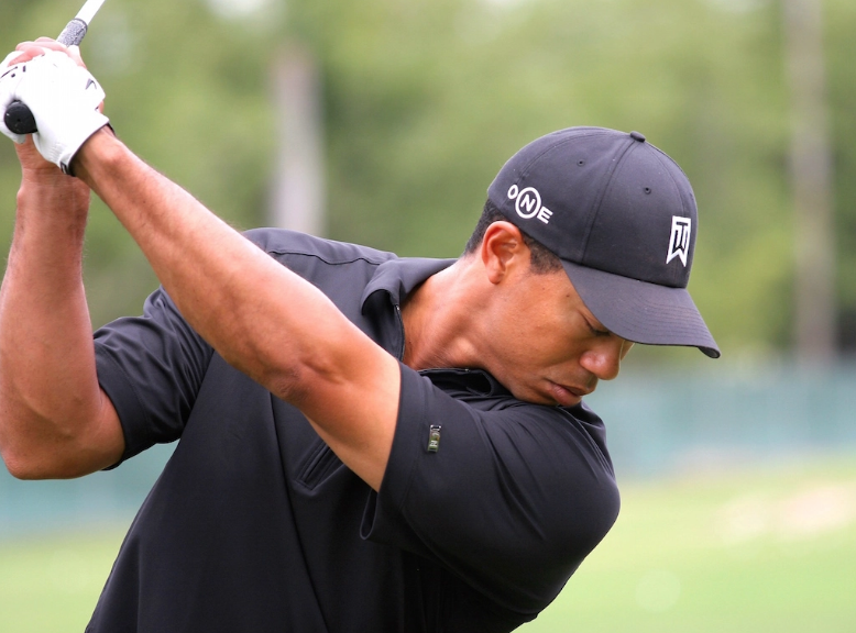 Tiger Woods' straight left arm in a golf swing