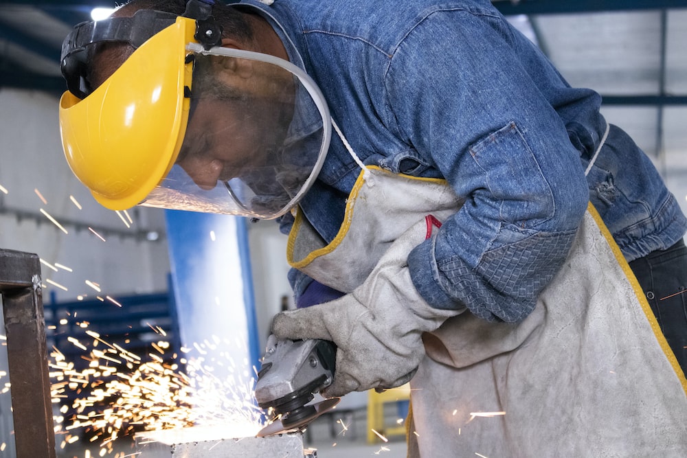 An employee wearing safety equipment to prevent workplace injuries