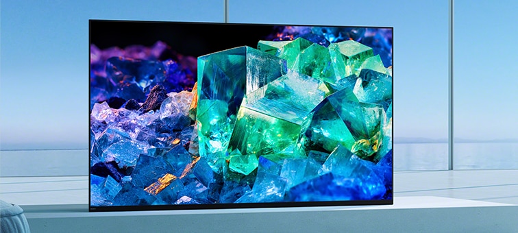 BRAVIA TV in living room on stand in Front position style for immersive viewing with image of colourful glass and crystals on screen