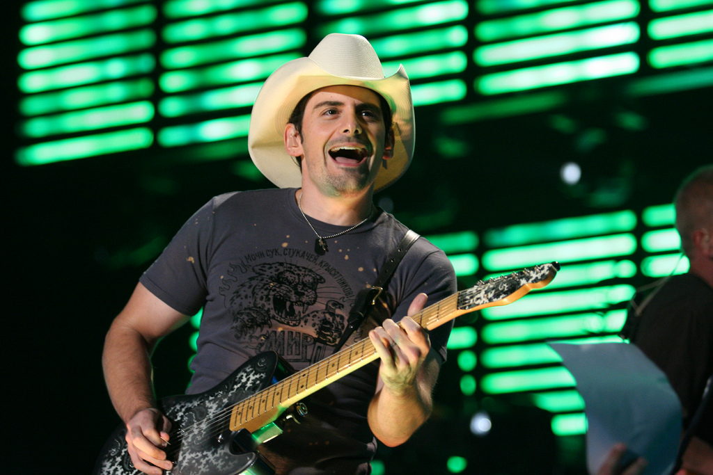 Brad Paisley playing guitar on stage 