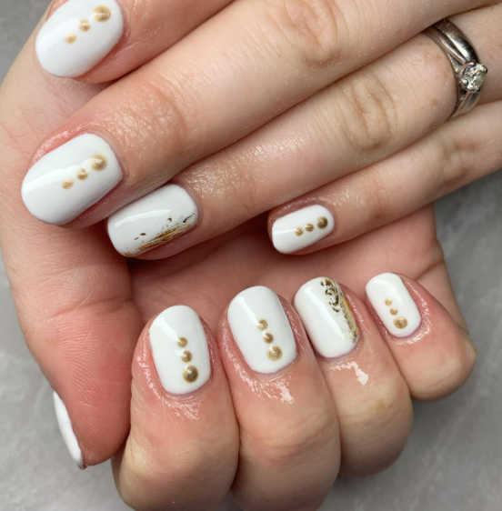 Golden Dots on white nails