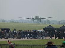 http://upload.wikimedia.org/wikipedia/commons/thumb/3/3b/Douglas_C-47_Skytrain_Dakota_landing_in_front_of_film_crew.JPG/220px-Douglas_C-47_Skytrain_Dakota_landing_in_front_of_film_crew.JPG