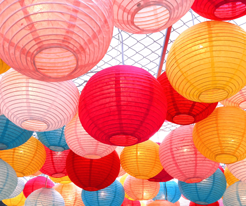Paper Lanterns hanging from a fence
