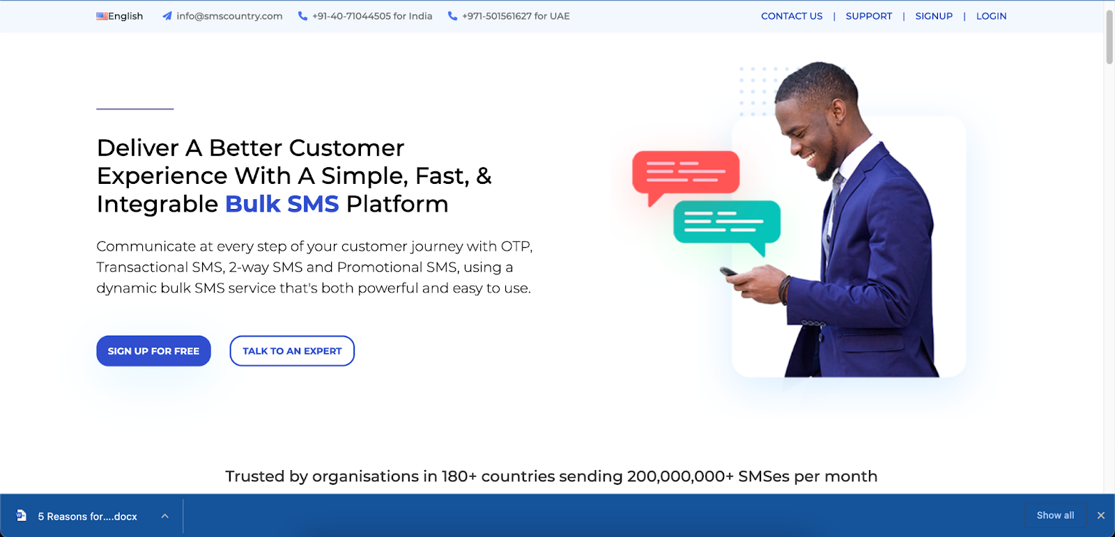 This is the homepage of the SMSCountry website. It shows content written all over with a image of a man holding a phone.
