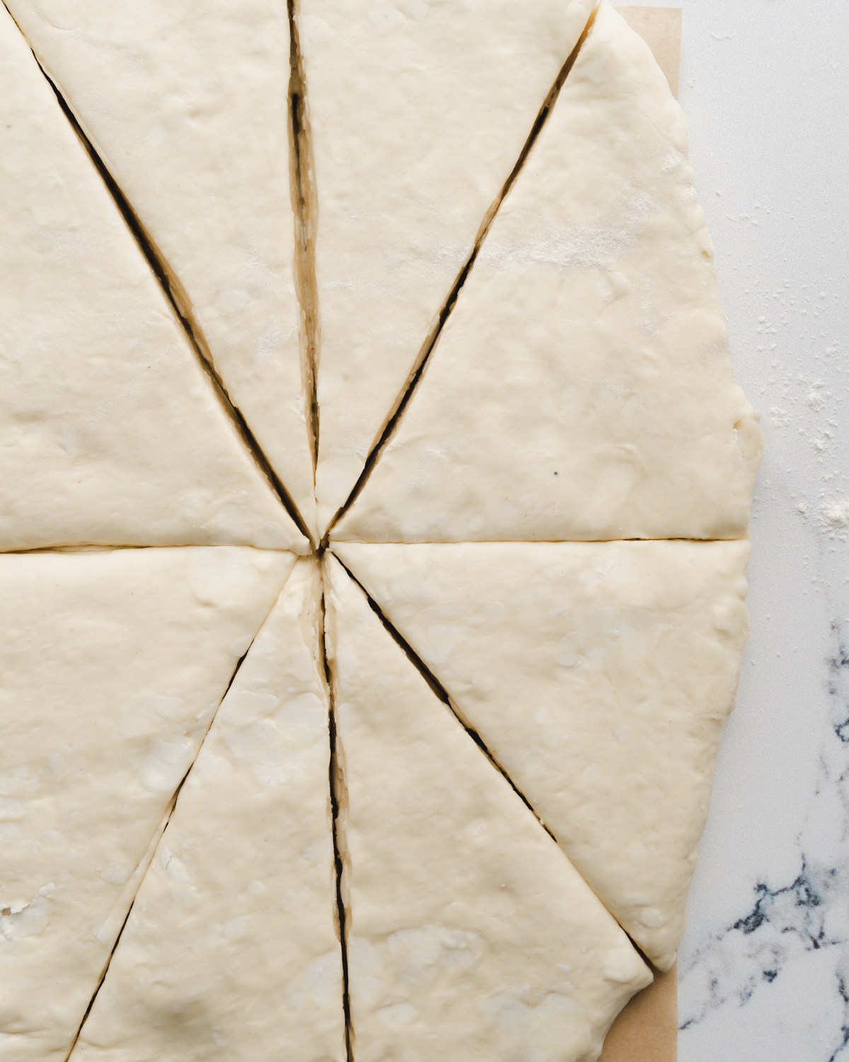 croissant dough cut up into triangles