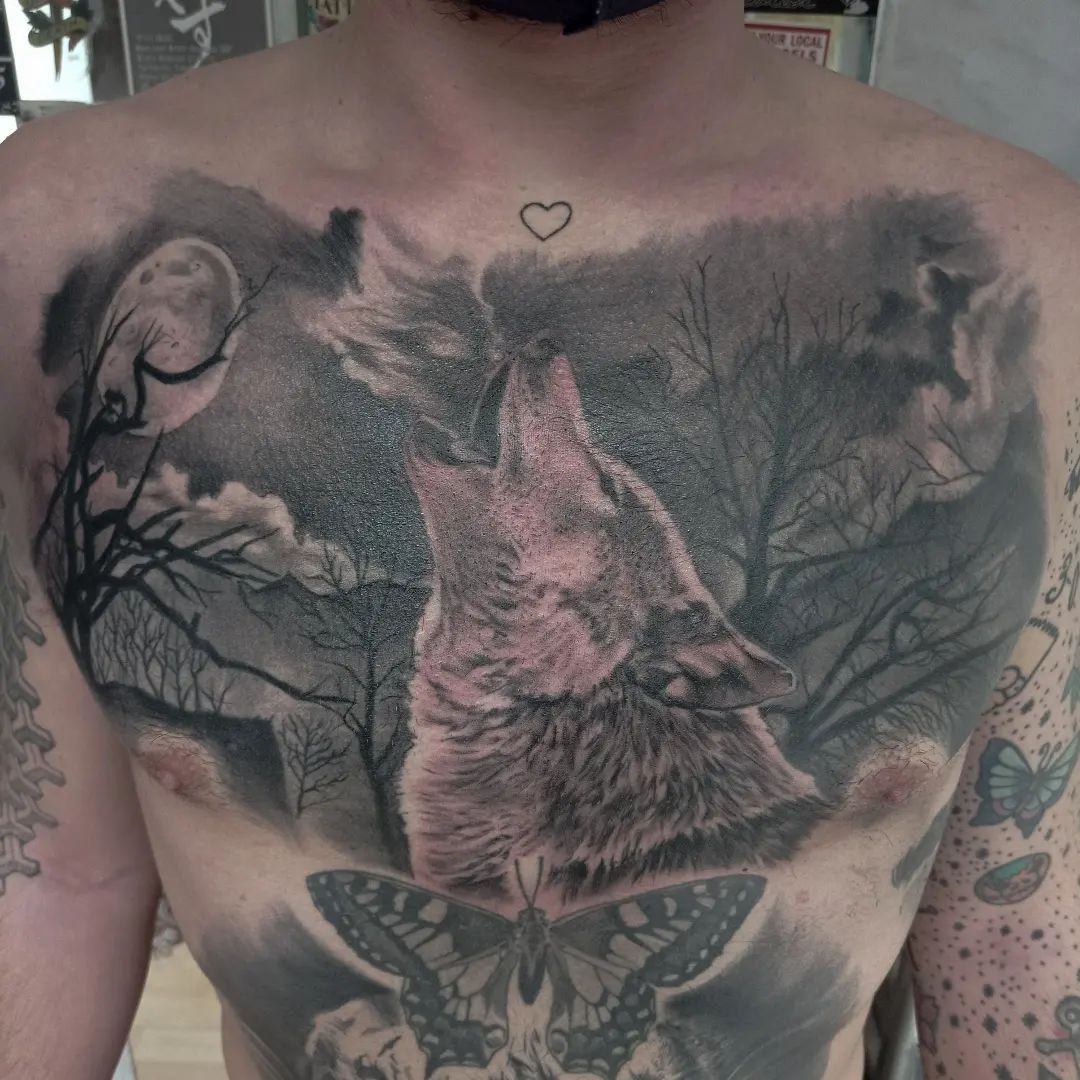 Wolf With Butterfly Tattoo
