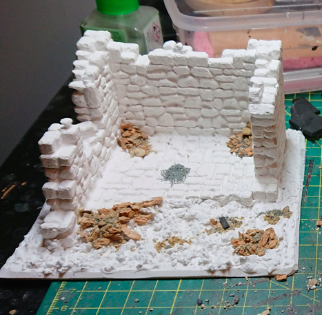 White plaster ruin mounted on foamex board with gravel and other basing materials applied