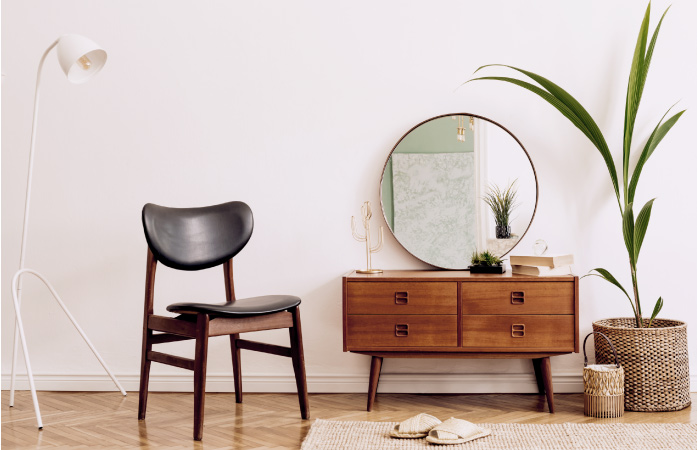 A living room with a feng shui mirror