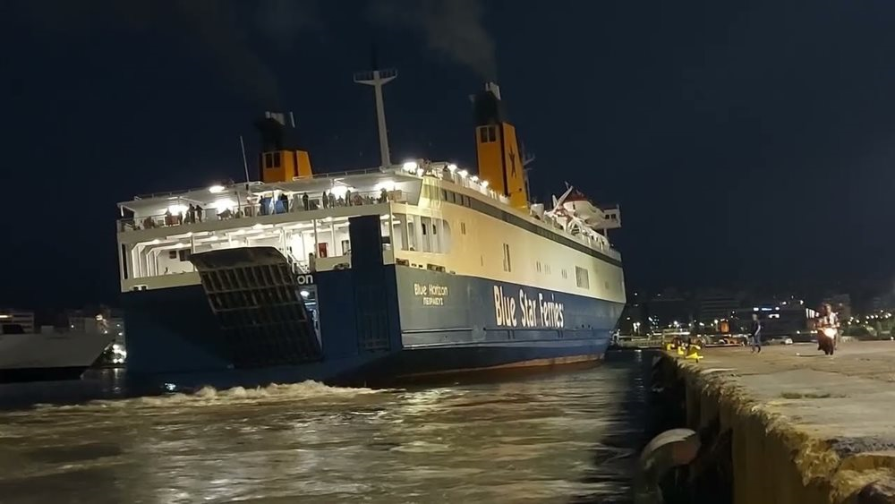 A large ship in the water at night

Description automatically generated