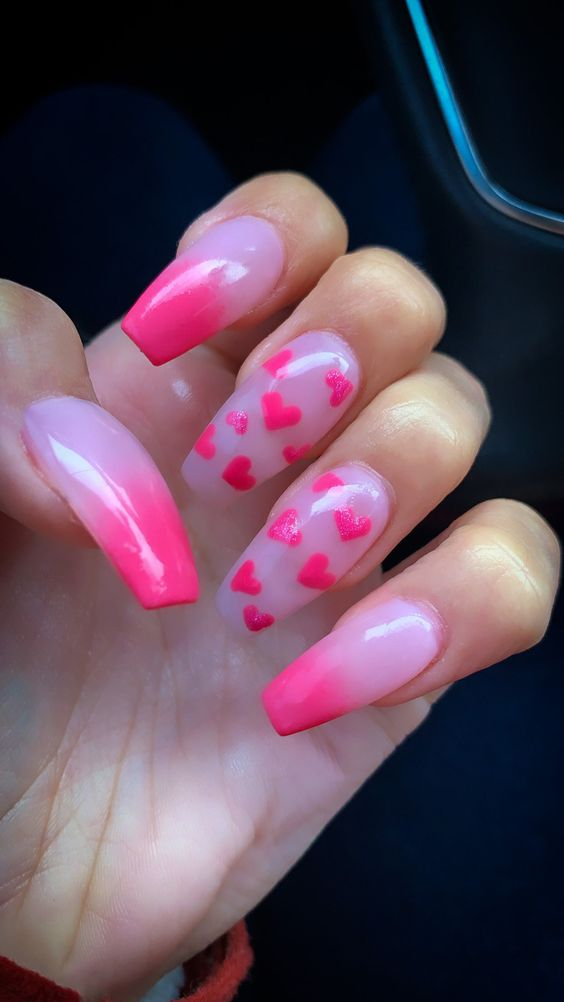 Another look of statement hearts on pink nails