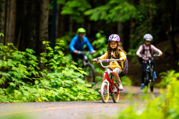 a girl riding a bike with friends