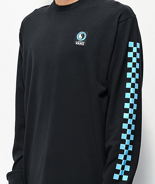 Black long sleeve tshirt with thick checkered line down the sleeve. The shirt has a ying-yang sing and the Vans logo on the breast area. 