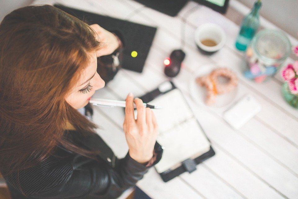 Young Woman Working, Writing, Planning 