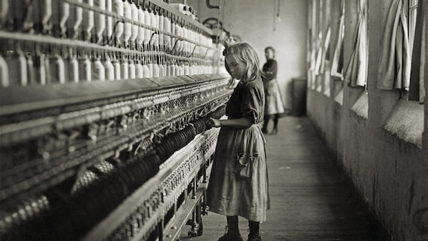 Old image of girl working a cotton mill in the early 1900s