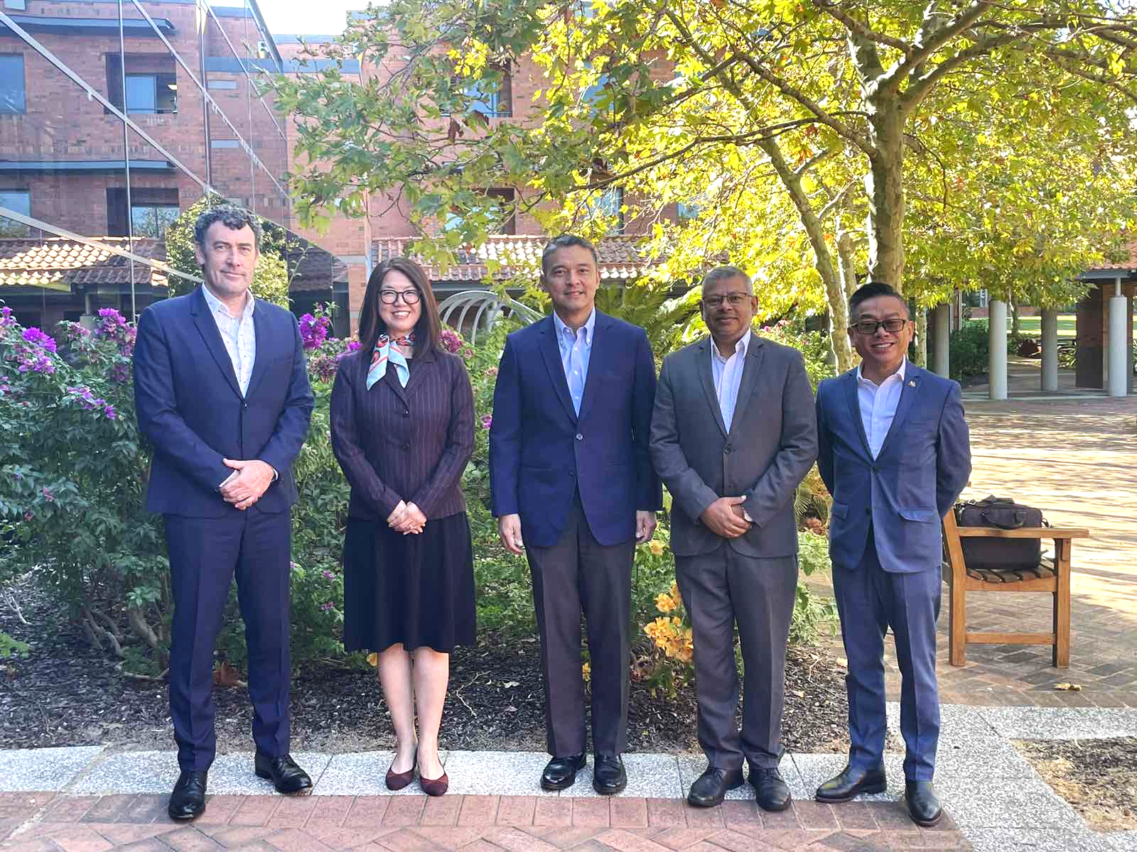 A group of people posing for a photoDescription automatically generated