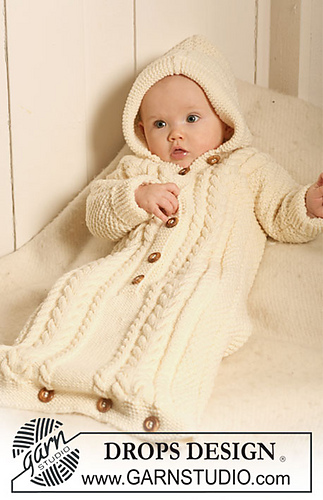 baby in a white hooded knit cocoon