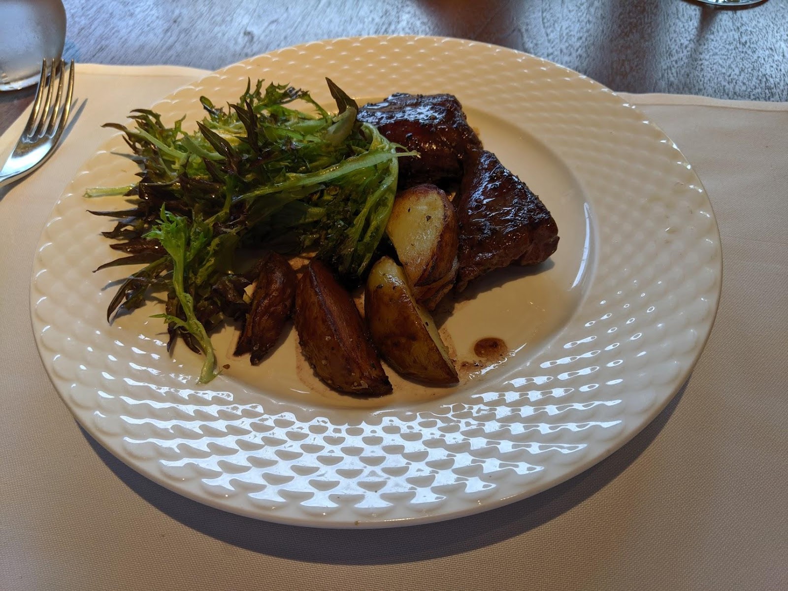 hanger steak with red wine butter, rosemary potatoes, leaf salad and mustard vinaigrette