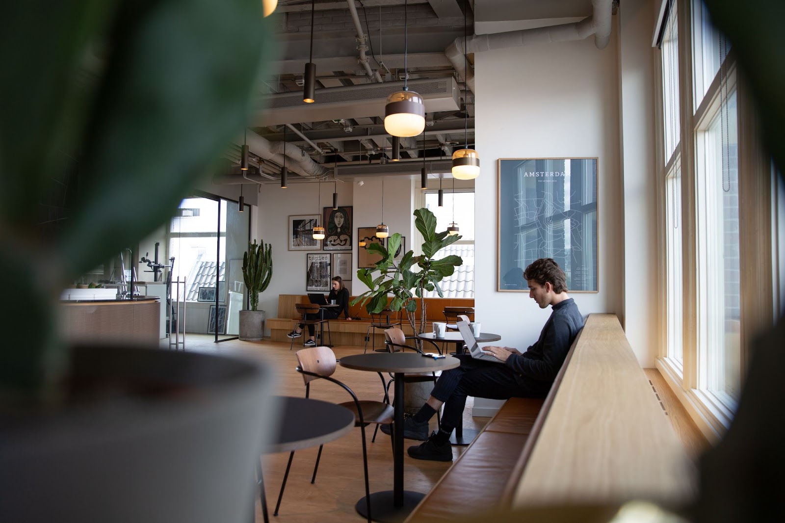 man working from a cafe