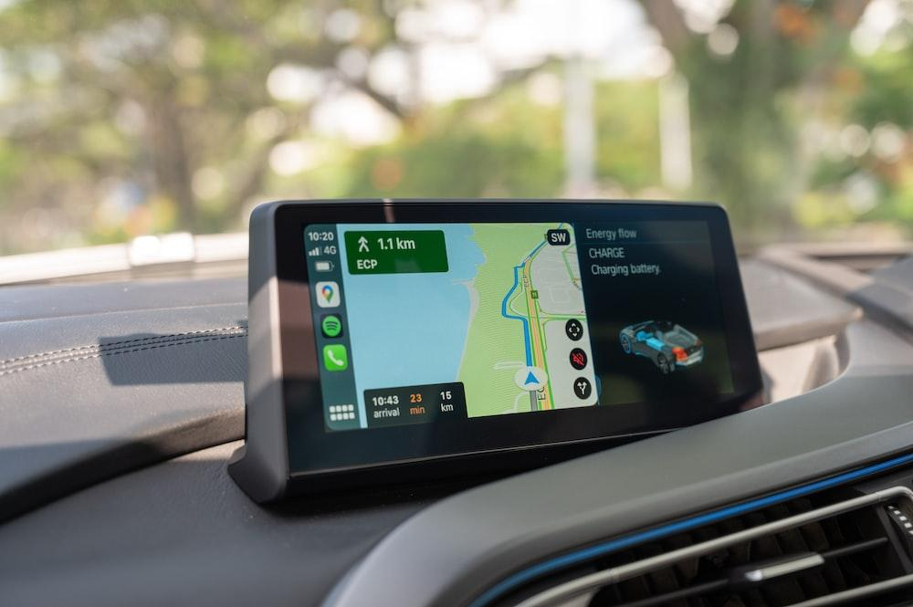 black android smartphone on car dashboard