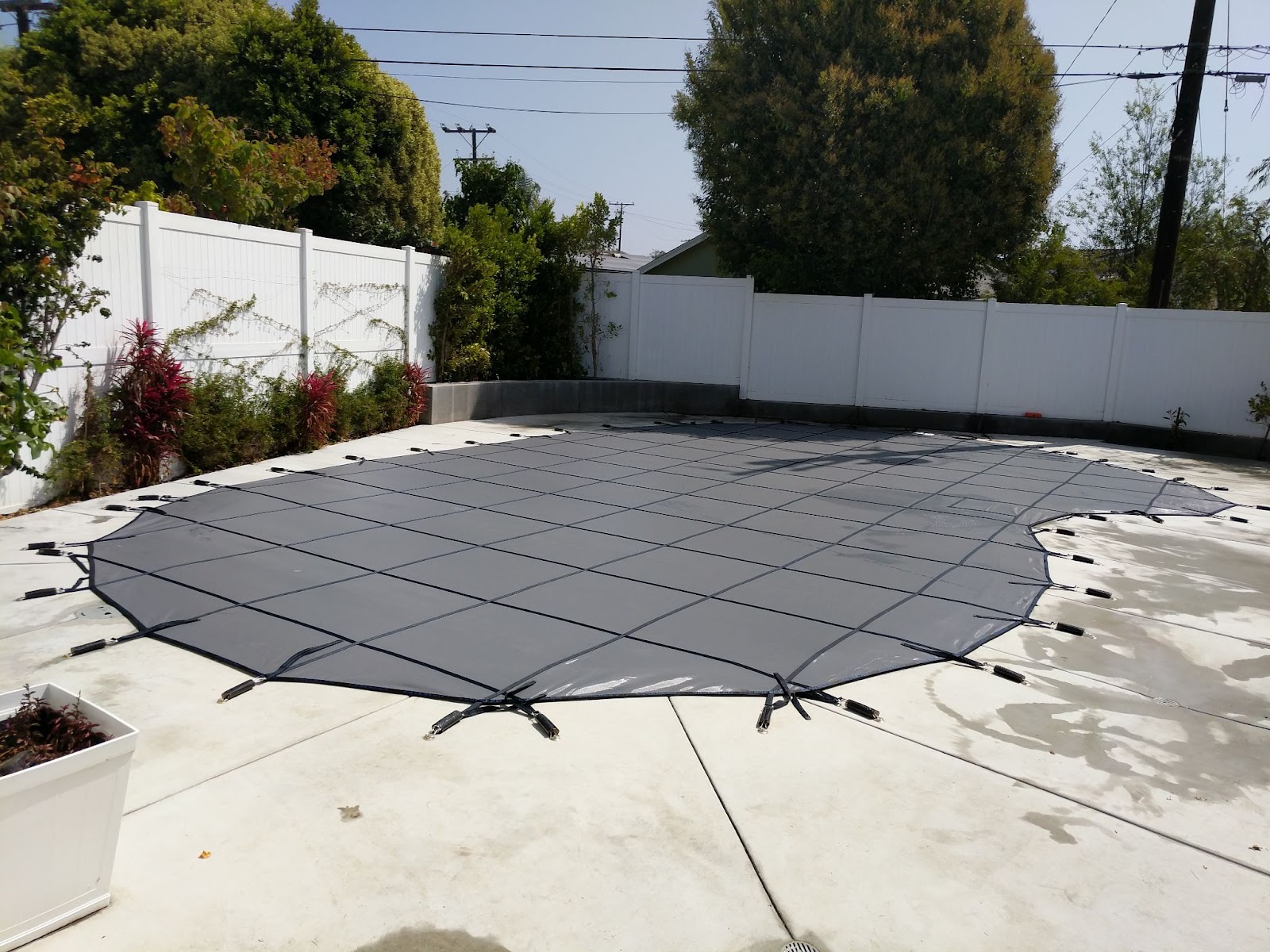 Installed black pool cover 