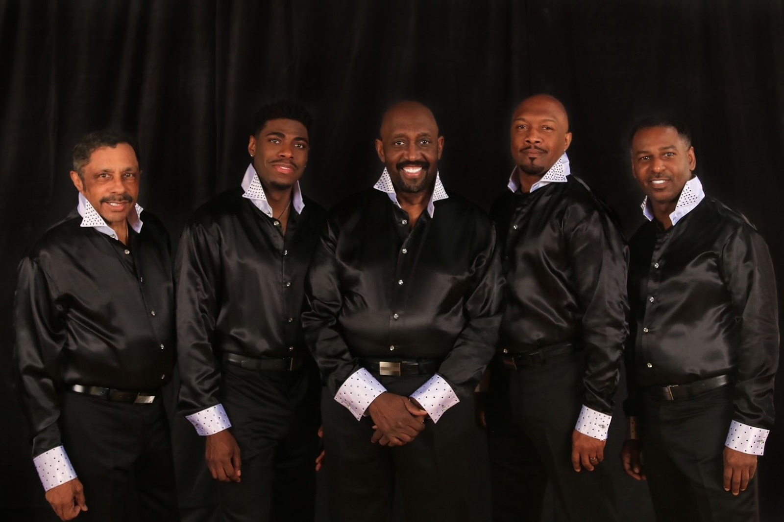 The Temptations group photo with black background for the CMM Waterside Music Series 