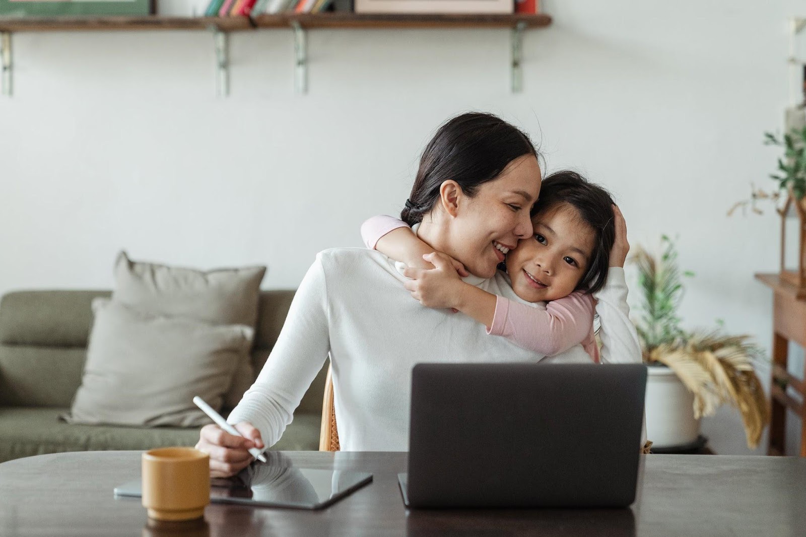 Generating a Side Income. mum and daughter with laptop.