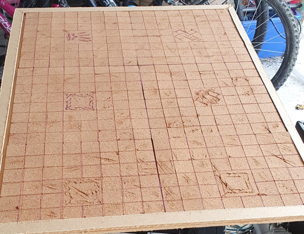 Full sized MDF base, covered with cork tiles etched into dungeon tiles.