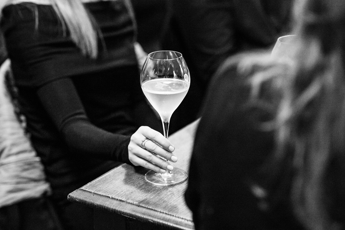 A woman holding a glass of wine