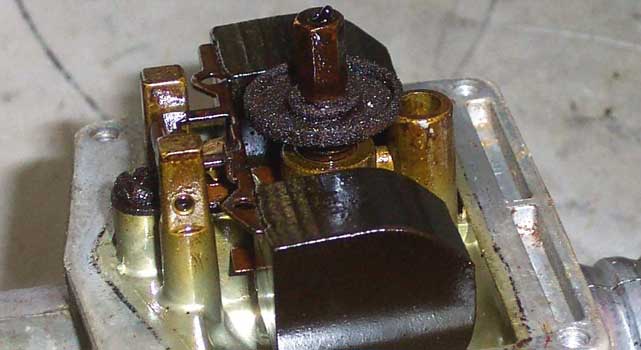 See the excessive carbon buildup on this carburetor? NEVER EVER let it get this bad.