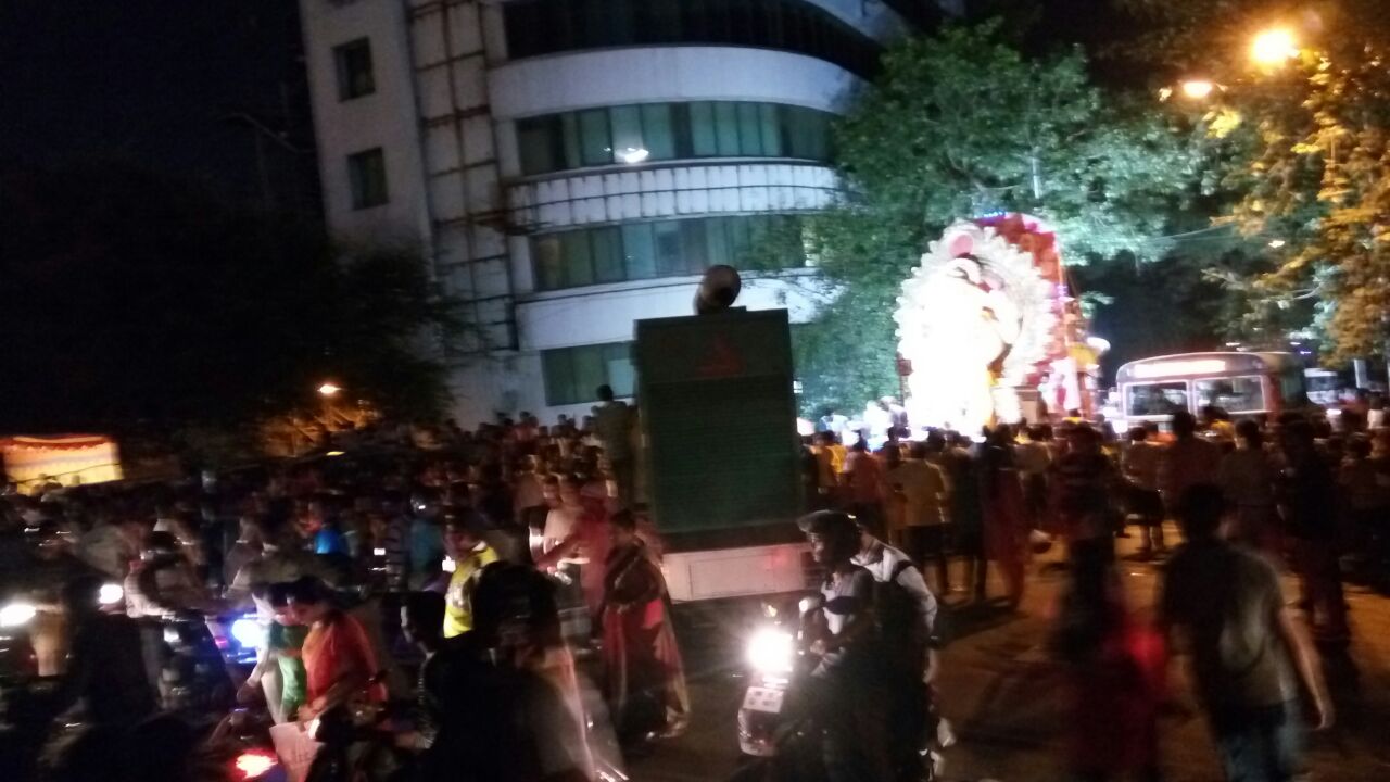 poor hindus dancing on the roads for ganesha