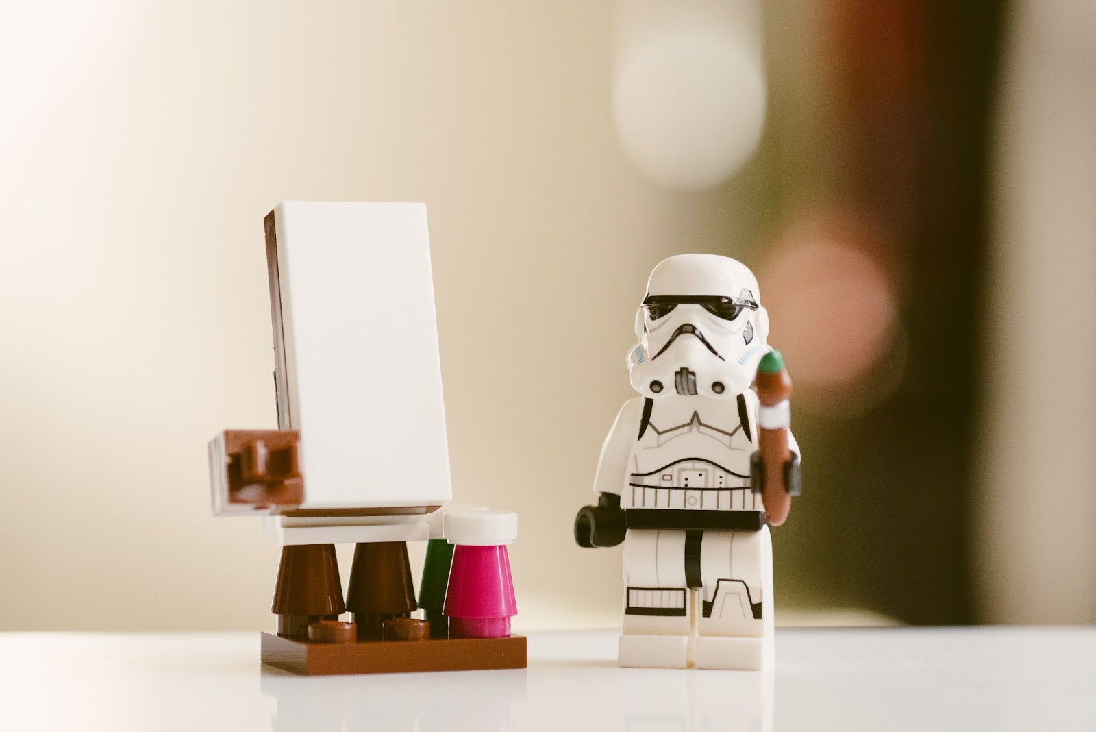Close-up of a stormtrooper Lego figure on a white table.