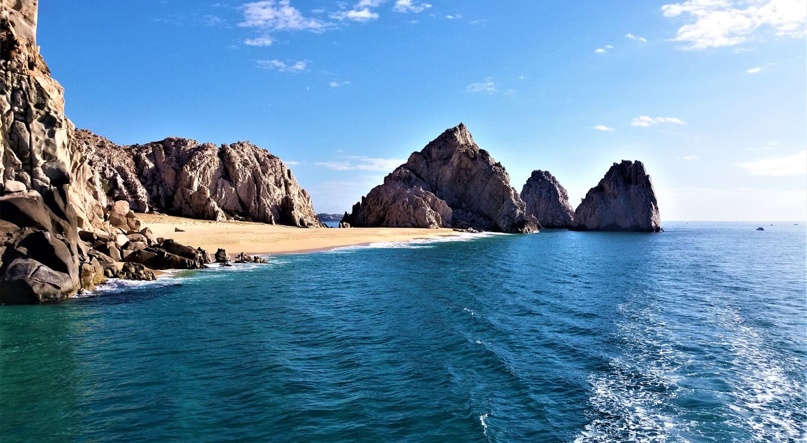 Sunny view of the beach from the ocean