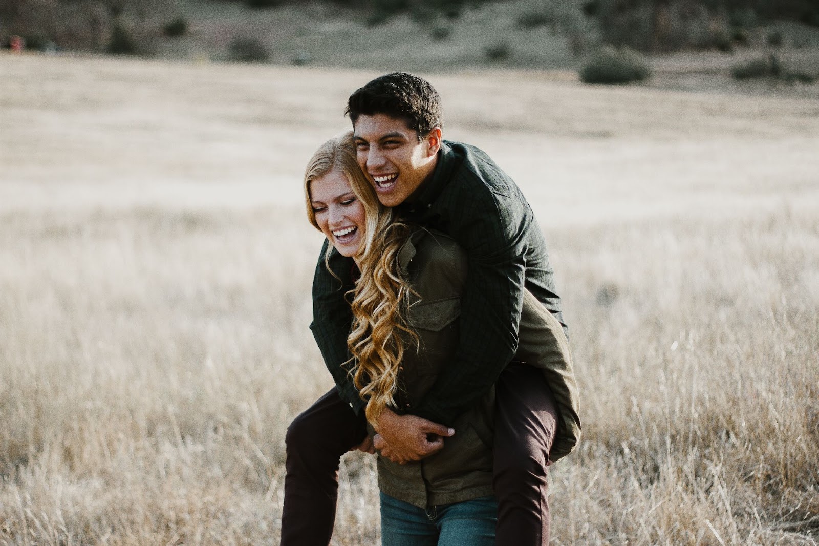 guy on girl's shoulders