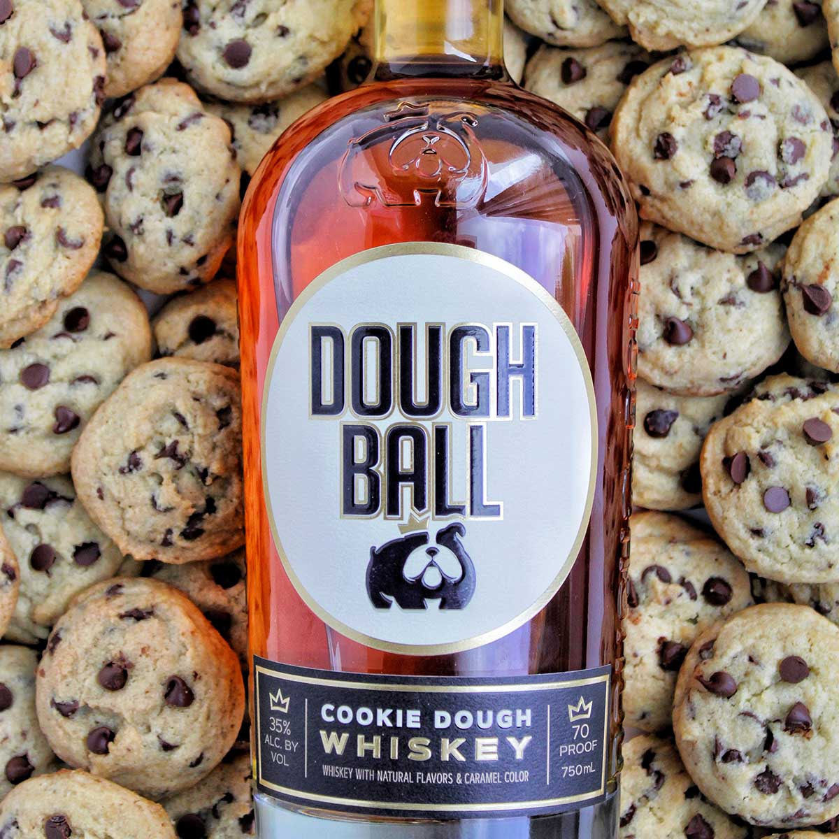 A bottle of whiskey lies on a cookie