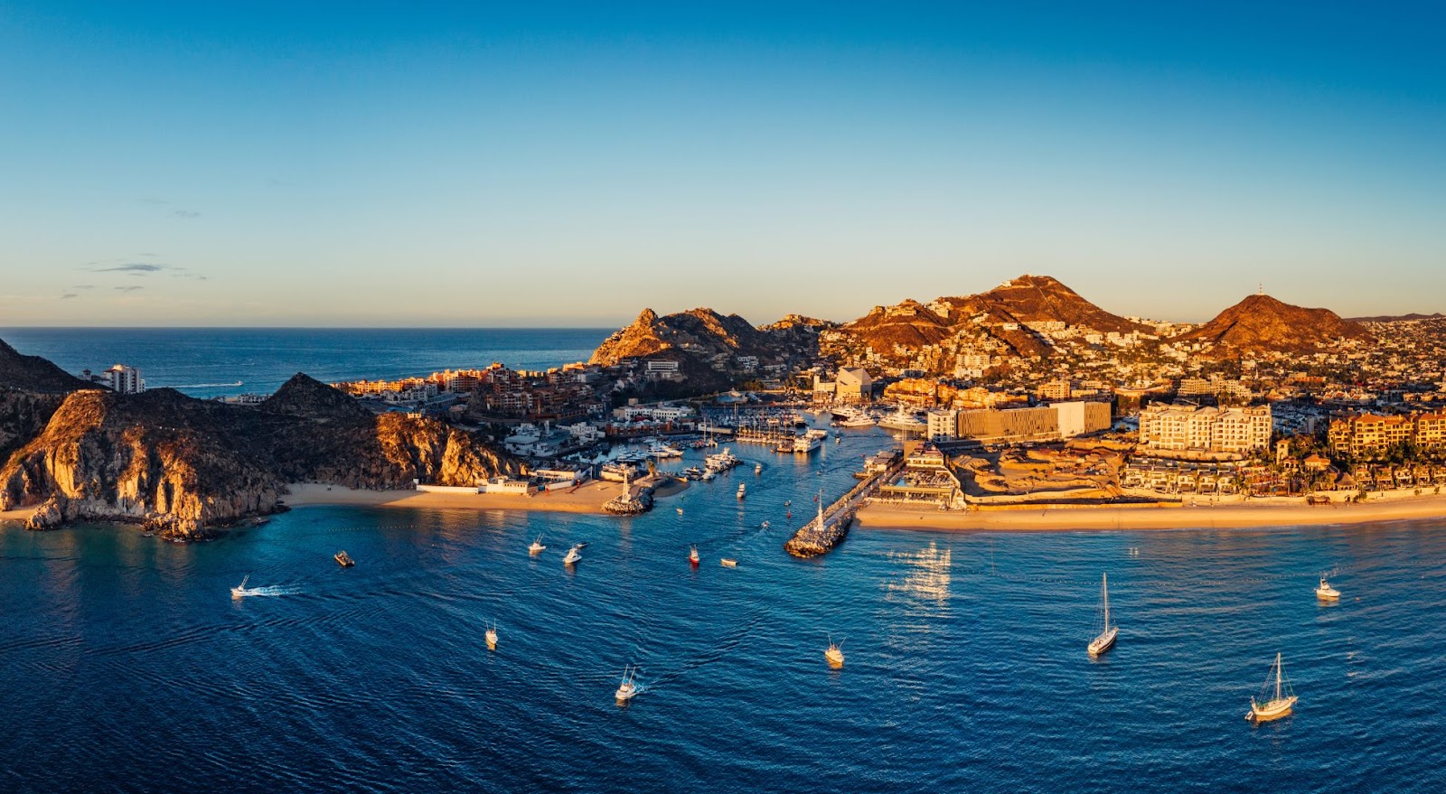 Boats in the waters of Cabo San Lucas in fall, the best time to go fishing 