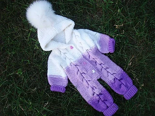 purple and white hooded romper lying on grass
