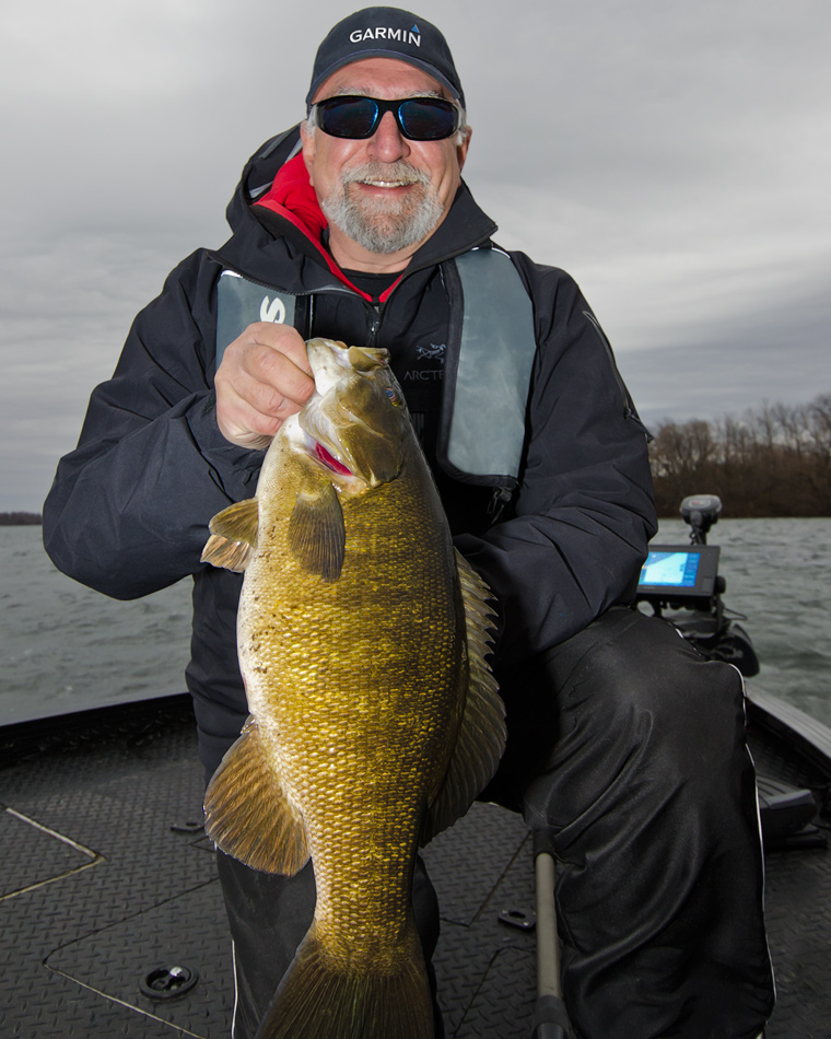Angelo with a fall smallmouth bass