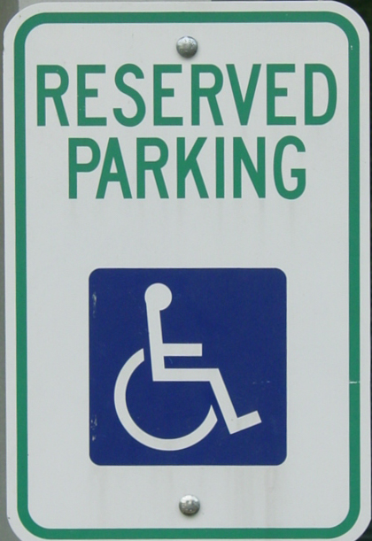 Reserved parking sign with the symbol of universal access. 
