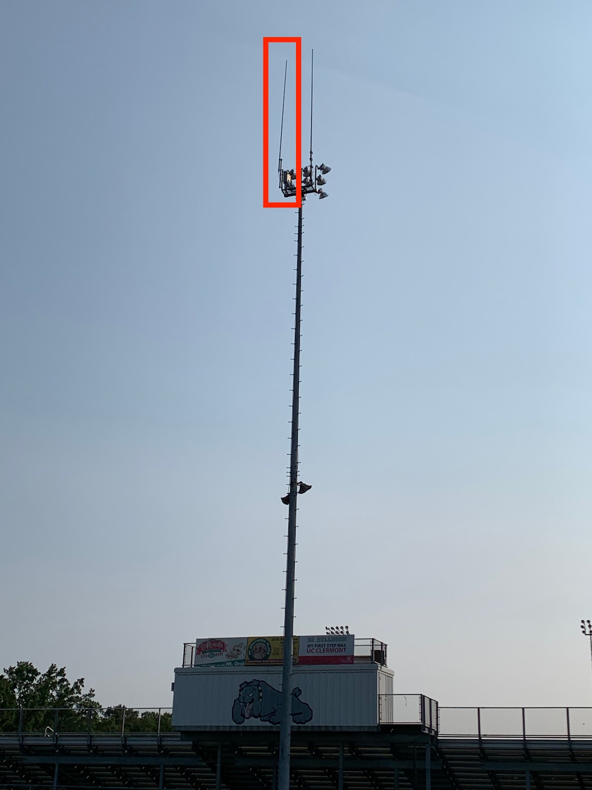 picture of the stadium light post with a second repeater antenna in a red box highlighted red box area shows where the second antenna is located for the new District emergency radio system.