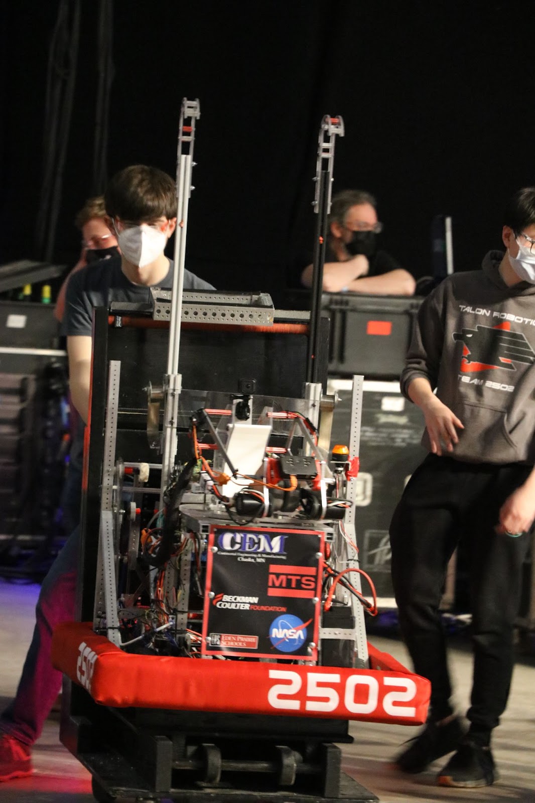 the pit crew using away from the field with the robot.