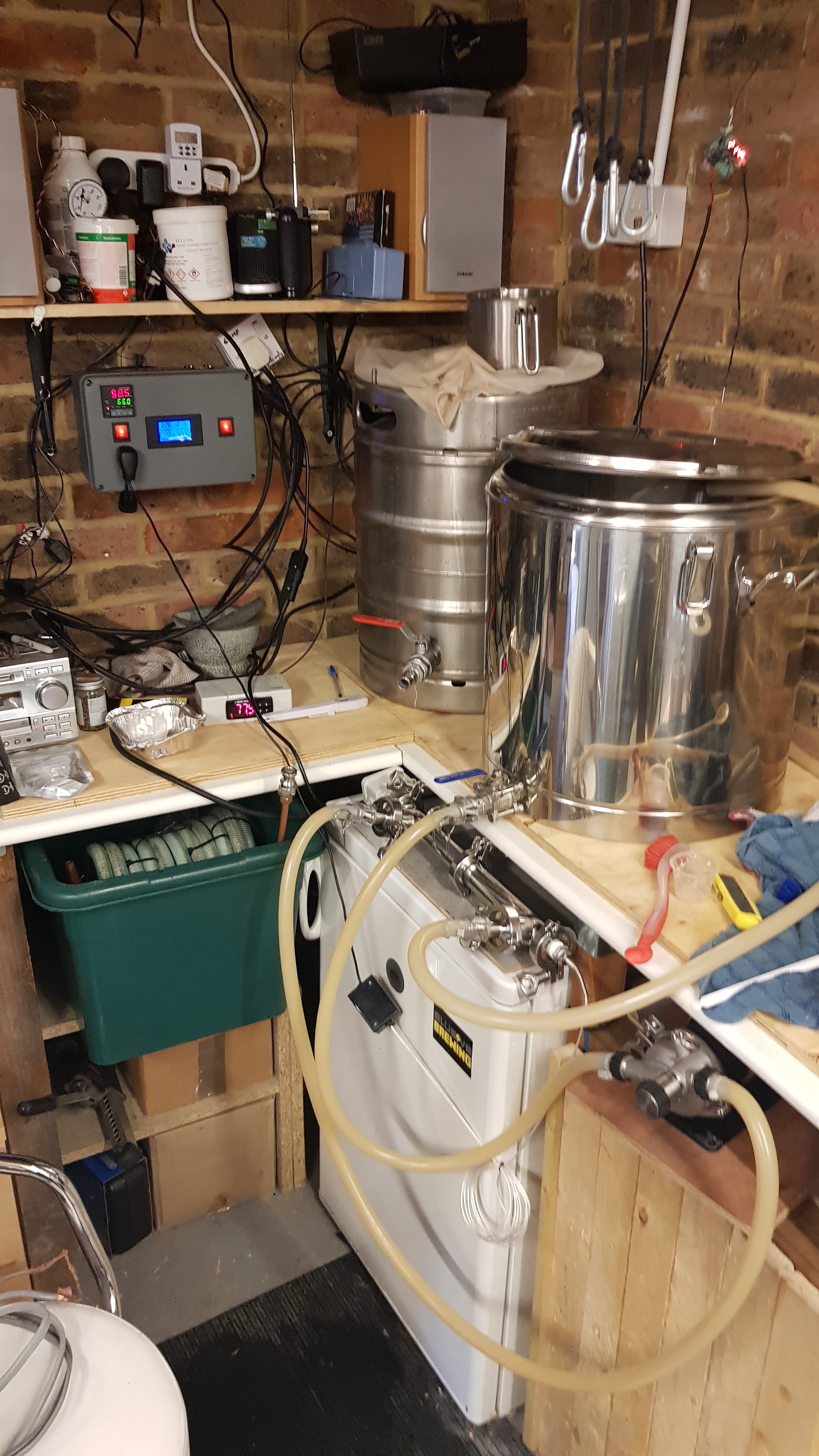 Image of a RIMS tube and control panel in a home brewery setting