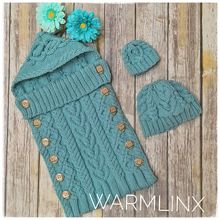 cabled baby sleep sack that has hood and matching hat