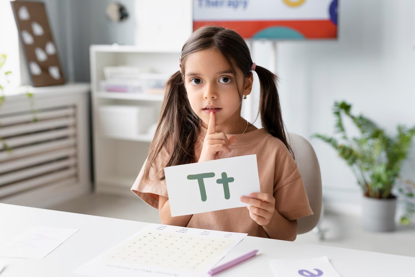 A little girl learning phonics