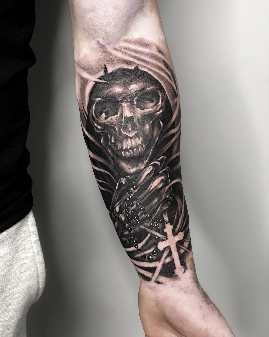 Black Skull With Cross Tattoo